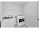 Spacious laundry room with front load washer and dryer at 204 Walkers Point Dr, Auburndale, FL 33823