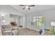 Living room with large window, neutral carpet and ceiling fan at 204 Walkers Point Dr, Auburndale, FL 33823