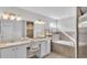 Bright bathroom features double sinks, white cabinetry, garden tub, and separate tiled shower at 204 Walkers Point Dr, Auburndale, FL 33823