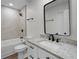 Modern bathroom with granite countertops, sleek black fixtures, and a shower-tub combination at 2052 W Elliott St, Lakeland, FL 33805