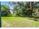 Large lot with mature trees offering a private, picturesque setting with ample natural light at 2052 W Elliott St, Lakeland, FL 33805