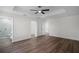 Spacious main bedroom with tray ceiling, recessed lighting, and a luxurious ensuite bathroom at 2052 W Elliott St, Lakeland, FL 33805