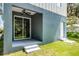 Covered patio with ceiling fan offers a cool outdoor space, accessible via sliding glass doors at 2052 W Elliott St, Lakeland, FL 33805
