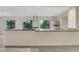 Bright kitchen with granite countertops, stainless steel appliances, and modern cabinets at 208 Lake Howard Nw Dr # 104, Winter Haven, FL 33880