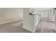 Modern kitchen features sleek white cabinetry and stainless steel appliances, with stylish tile flooring at 208 Lake Howard Nw Dr # 104, Winter Haven, FL 33880