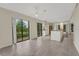 Open-concept living space with granite kitchen counter and tile flooring perfect for entertaining at 208 Lake Howard Nw Dr # 104, Winter Haven, FL 33880