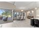 Dining room with modern furnishings and seamless access to the outdoor living area and pool at 209 Pine Lilly Ct, Lake Alfred, FL 33850