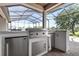 This outdoor kitchen features stainless steel appliances and ample counter space for entertaining at 209 Pine Lilly Ct, Lake Alfred, FL 33850