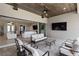 Inviting covered outdoor living area, perfect for relaxation with comfortable seating and a great view at 209 Pine Lilly Ct, Lake Alfred, FL 33850