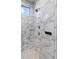 Modern shower featuring marble tile with body jets and rainfall shower head at 209 Pine Lilly Ct, Lake Alfred, FL 33850