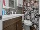 Bathroom featuring a modern sink and vanity with dark wood cabinets and a floral shower curtain at 2480 Avenue E Sw, Winter Haven, FL 33880