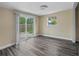 Unfurnished bedroom featuring a sliding glass door to backyard and neutral paint at 2480 Avenue E Sw, Winter Haven, FL 33880