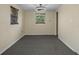 Cozy bedroom with plush carpet, natural light, and a ceiling fan for added comfort at 2480 Avenue E Sw, Winter Haven, FL 33880