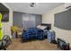 Relaxing bedroom with soft natural light, tile floors, and comforting space to recharge at 2480 Avenue E Sw, Winter Haven, FL 33880