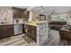 Inviting kitchen with granite counters, stainless steel appliances, and open view to the living room at 2480 Avenue E Sw, Winter Haven, FL 33880