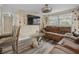 Inviting living room featuring a comfortable sofa, mounted TV, and modern accents at 2480 Avenue E Sw, Winter Haven, FL 33880