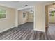 Spacious living room boasts gray wood flooring and an open design, perfect for modern living at 2480 Avenue E Sw, Winter Haven, FL 33880