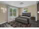Relaxing main bedroom with a sliding glass door to backyard and neutral decor at 2480 Avenue E Sw, Winter Haven, FL 33880