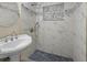Elegant shower featuring decorative tile work, handheld shower head, and sleek design at 2480 Avenue E Sw, Winter Haven, FL 33880