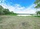 Expansive backyard view with lake access at 2530 Arbuckle Shores Rd, Frostproof, FL 33843