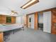 Bedroom featuring log walls, carpet, and closets for ample storage at 2530 Arbuckle Shores Rd, Frostproof, FL 33843