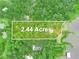 Aerial view showing a 2.44-acre parcel, lush greenery and tranquil waterfront access for a serene lifestyle at 2530 Arbuckle Shores Rd, Frostproof, FL 33843