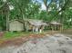 Exterior shot of outbuildings surrounded by mature trees at 2530 Arbuckle Shores Rd, Frostproof, FL 33843