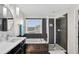 Bright bathroom featuring a soaking tub, walk-in shower, single vanity, and contemporary fixtures at 2612 San Simeon Way, Kissimmee, FL 34741