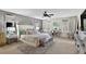 Spacious bedroom with a decorative accent wall, large windows, and a stylish bed at 2612 San Simeon Way, Kissimmee, FL 34741