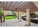Outdoor patio area featuring covered furniture, ceiling fan, and tile flooring at 2612 San Simeon Way, Kissimmee, FL 34741