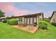 Enjoyable backyard including luscious greenery and outdoor seating for relaxation and entertainment on a comfortable concrete patio at 2835 Wingfoot Ct, Winter Haven, FL 33884