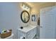 Cozy bathroom featuring a vanity and an adjacent door to a closet or toilet at 2835 Wingfoot Ct, Winter Haven, FL 33884