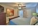 Inviting bedroom with wood accents, bright art, and multiple doorways at 2835 Wingfoot Ct, Winter Haven, FL 33884