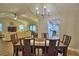 Open dining and living area featuring modern lighting and hardwood flooring at 2835 Wingfoot Ct, Winter Haven, FL 33884