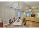 Bright dining room featuring a modern light fixture and hardwood floors at 2835 Wingfoot Ct, Winter Haven, FL 33884
