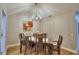 Dining room featuring a modern light fixture and hardwood floors at 2835 Wingfoot Ct, Winter Haven, FL 33884