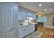 This kitchen features white cabinets, recessed lighting, and hardwood flooring at 2835 Wingfoot Ct, Winter Haven, FL 33884