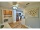 Modern kitchen near laundry area, featuring stainless steel appliances and white cabinetry at 2835 Wingfoot Ct, Winter Haven, FL 33884