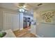Bright kitchen offers stainless steel appliances, white cabinets and easy access to laundry at 2835 Wingfoot Ct, Winter Haven, FL 33884