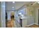 Well-lit kitchen with stainless steel appliances, white cabinets, and modern fixtures at 2835 Wingfoot Ct, Winter Haven, FL 33884
