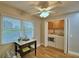Well-lit laundry room with modern washer and dryer, a charming table, and natural light at 2835 Wingfoot Ct, Winter Haven, FL 33884