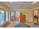 Sunny living area offers easy access to the outdoors, ample natural light and comfortable seating at 2835 Wingfoot Ct, Winter Haven, FL 33884