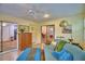 Inviting living room with a plush futon, decorative cabinet, and view of a dining area at 2835 Wingfoot Ct, Winter Haven, FL 33884