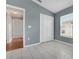 Bedroom featuring tile floors, a double-door closet and a window for natural light at 362 Lake Daisy Cir, Winter Haven, FL 33884