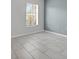 Bedroom with light gray walls and ceramic tile flooring at 362 Lake Daisy Cir, Winter Haven, FL 33884