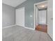 Bedroom with closet, gray walls, and ceramic tile flooring at 362 Lake Daisy Cir, Winter Haven, FL 33884