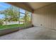 Covered screened patio with view of the fenced backyard at 362 Lake Daisy Cir, Winter Haven, FL 33884