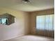 Spacious living room with neutral carpeting and ample natural light at 381 Troon Ct, Winter Haven, FL 33884