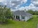 Aerial view of home with lawn and porch at 3985 Mammoth Grove Rd, Lake Wales, FL 33898