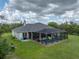 Aerial view of a home featuring an enclosed backyard pool with lawn at 3985 Mammoth Grove Rd, Lake Wales, FL 33898